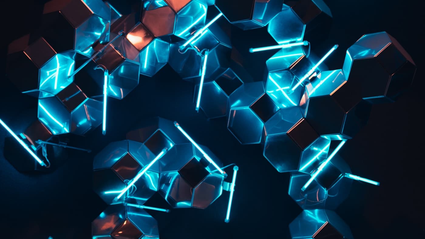 Abstract teal and cyan hexagonal nodes glowing against a dark background — a network of connected systems